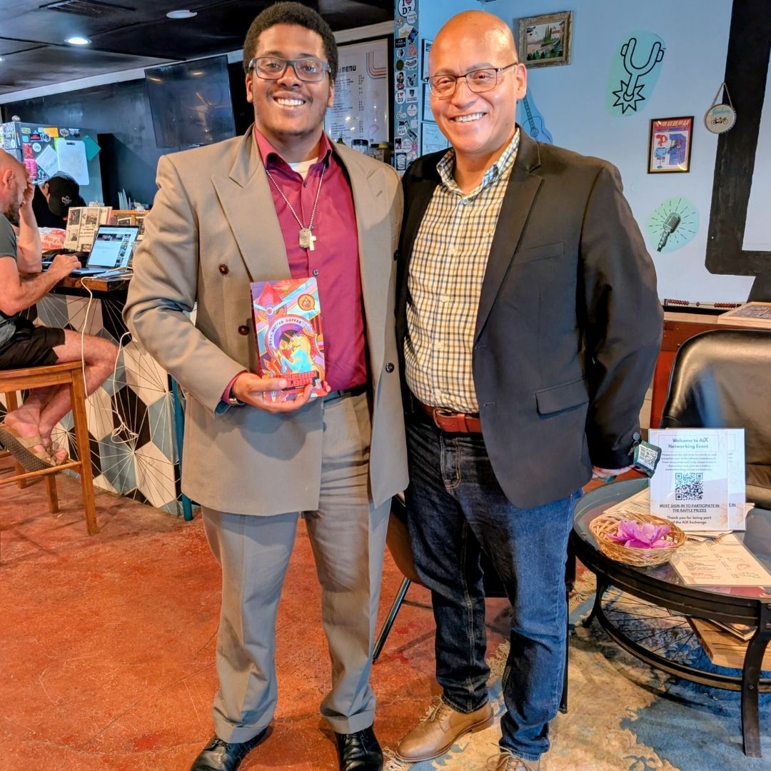 AI Exchange attendee holding Dark Matter Coffee raffle prize