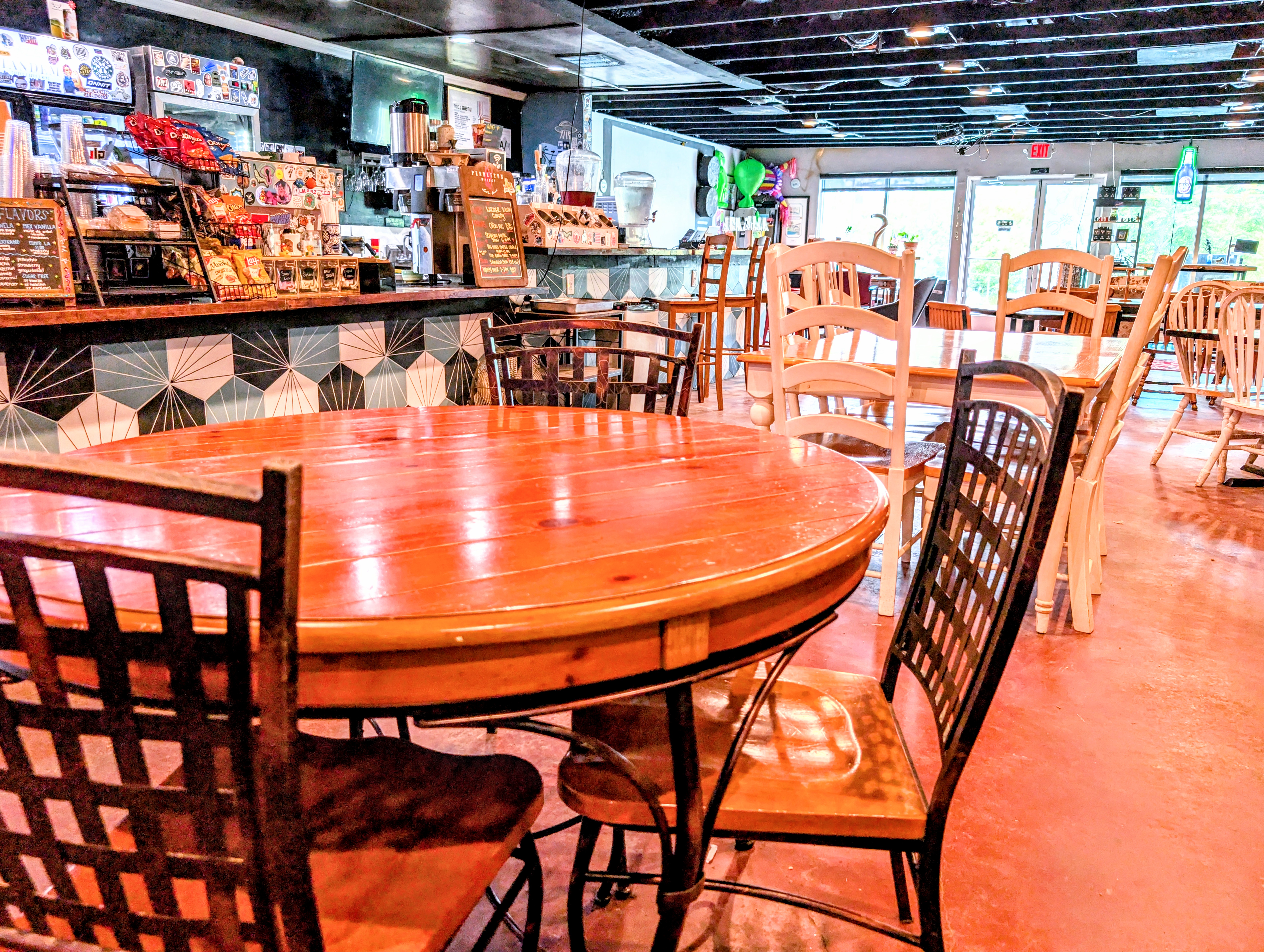 Bright, art-filled seating area at Tandem Coffee, Wine & Beer